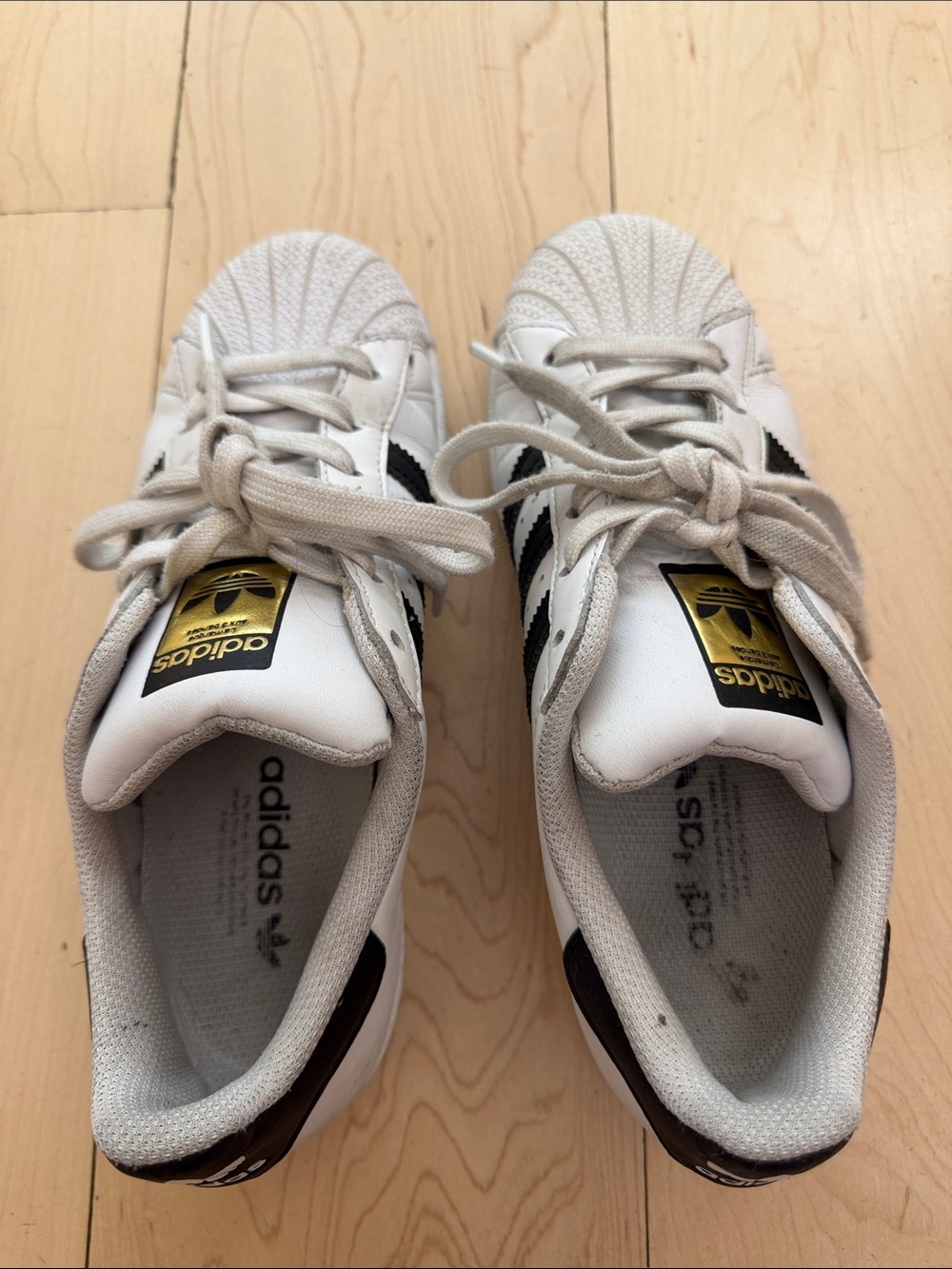 adidas White Sneakers with Black Stripes and Gold Tongue Logo